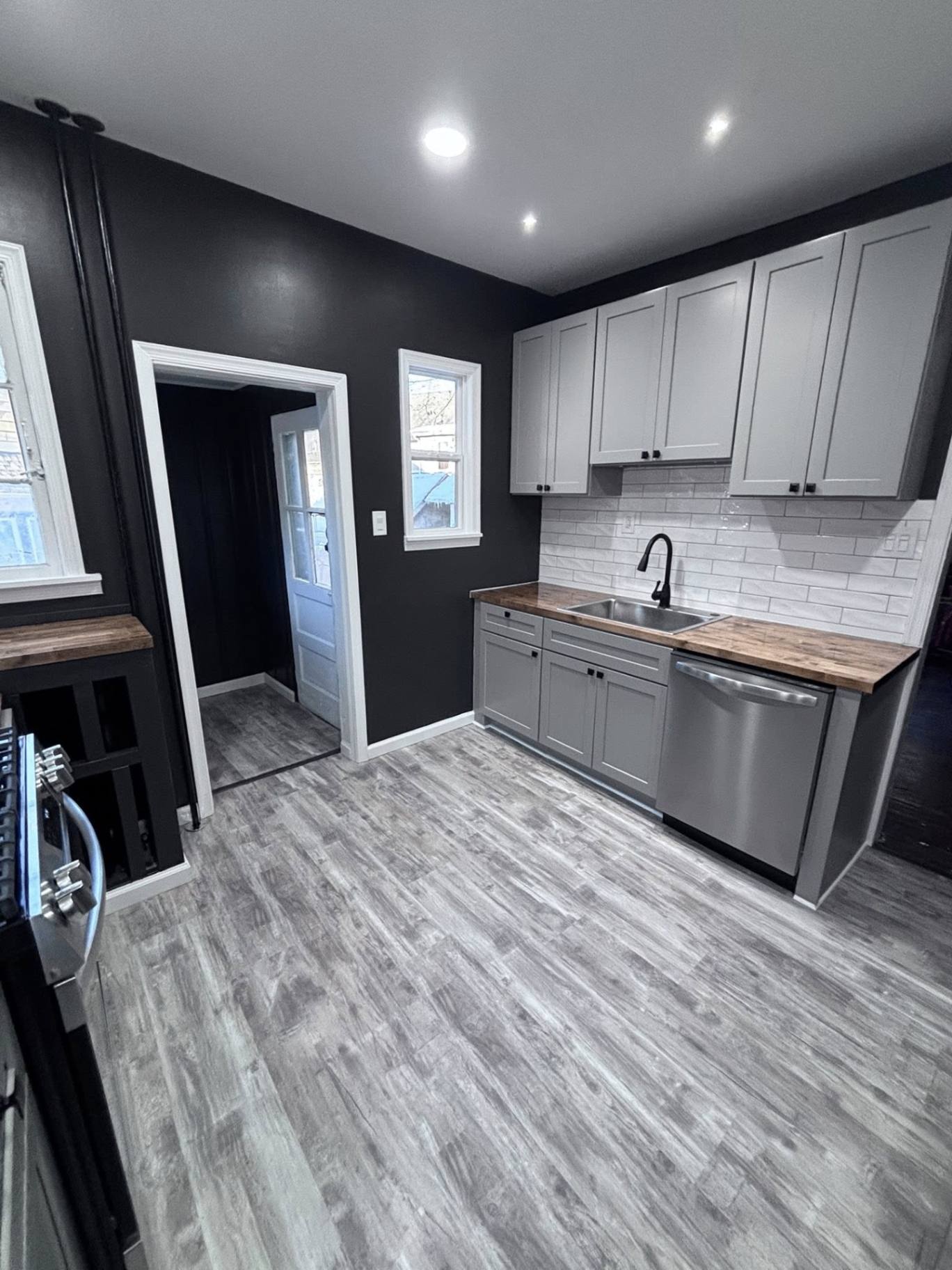 Kitchen remodel with sink wall and gray cabinets