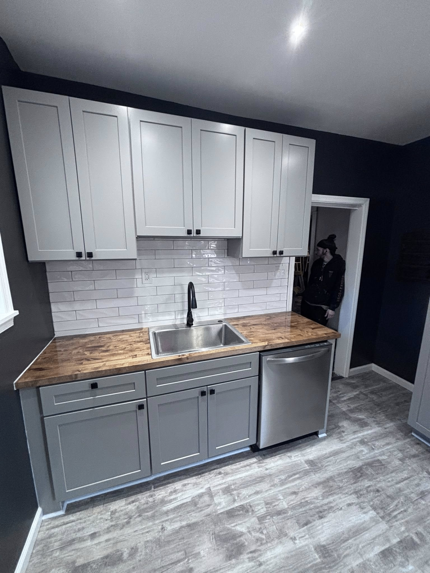 Kitchen remodel with gray cabinets and wood countertops
